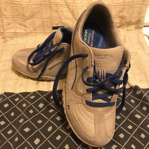 Women’s Skechers tan/blue leather/textile upper.